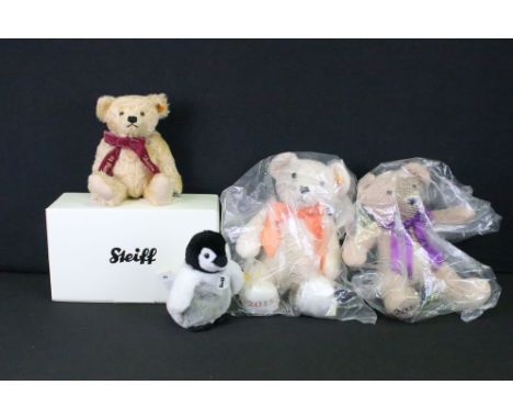 Four Steiff bears and soft toys to include a boxed I Belong to Sheila bear, Flaps the Penguin, beige cosy (bagged) and cream 