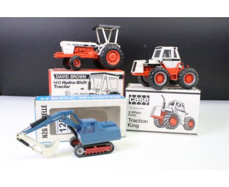 Three boxed NZG diecast models to include David Brown 1412 Hydra Shift Tractor, CASE 4 Wheel Drive Traction King) and Fuchs 7