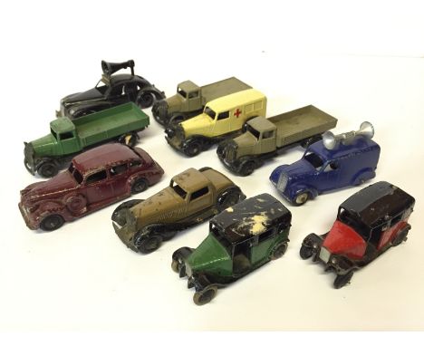 Nine Dinky Toys commercial and car models, includes 30f Bentley Ambulance, 34 Loud Speaker Van, 2 x 36g Taxi, one green with 