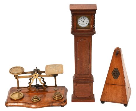 A set of Victorian walnut and brass postal scales, John Heath, Birmingham, a miniature oak longcase clock and a French walnut