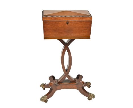 A Victorian mahogany teapoy, sarcophagus shape, with fitted interior, brass castors, 76cm h; 25 x 40cm Old shrinkage crack to
