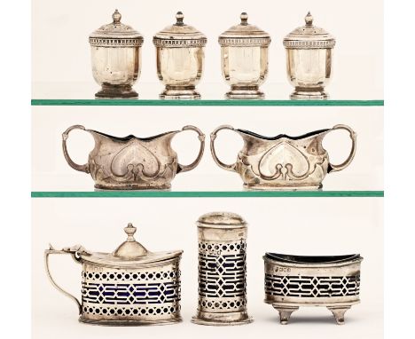 A Victorian pierced silver condiment set, blue glass liners, pepperette 70mm h, by Haseler Brothers, London 1899, a pair of E