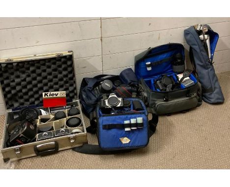 A selection of camera and camera equipment to include various lenses, canon bodies and Kier cameras
