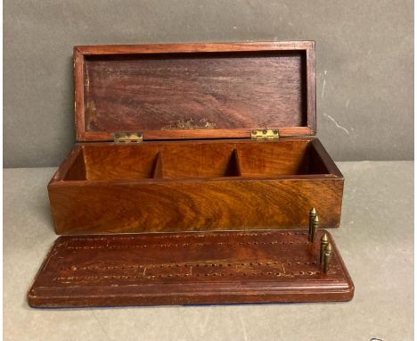 A mahogany box containing a cribbage board and four brass counters AF 