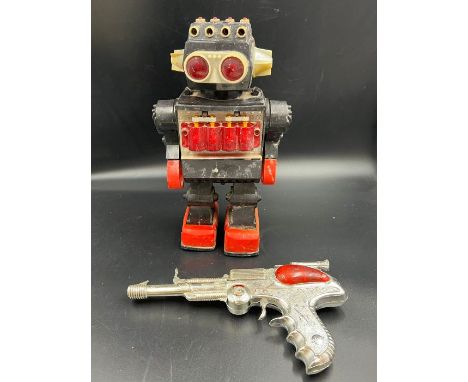 A Space Robot and a space outlaw toy gun AF 