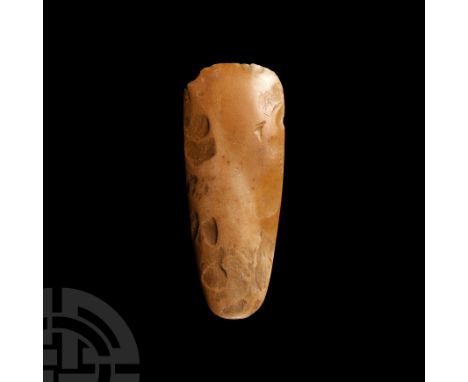 Neolithic Period, 5th-3rd millennium B.C. Finely polished with convex cutting edge tapering with narrow squared edges to thin