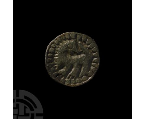 9th century A.D. Displayed in low-relief with raised tail, pellet eye, radiating mane, band of pellets to the border; pin-lug