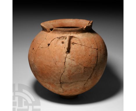 1st-2nd century A.D. For the deposition of ashes (absent), with bulbous body, everted rim and discoid foot, a stylised human 