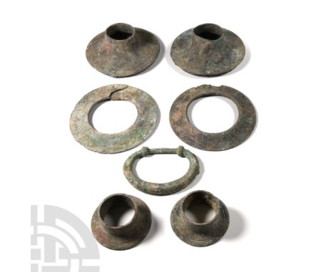 1st-4th century A.D. Comprising three pairs of fittings of different types, together with a terret ring; one split. 1.4 kg to