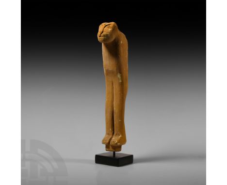 Late Period, 664-332 B.C. Representing the head, chest and split forelegs of a lion with ochre-tan surface and applied black 