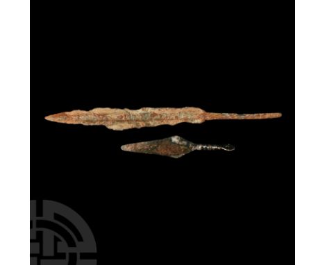 1st millennium B.C. Comprising a pendant in the form of a spearhead, balustered neck with suspension loop; remains of a spear