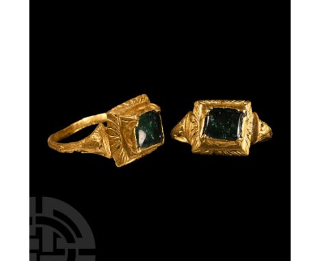 16th-early 17th century A.D. Slender carinated hoop with splayed shoulders and chased ornament, tiered rectangular bezel disp