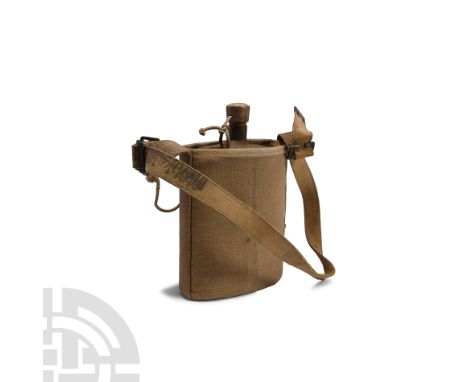 Dated 1940 A.D. Felt covered steel water bottle of oval cylindrical shape with wood plug stopper with cord retainer and fitte