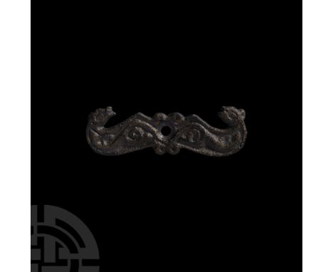 9th-11th century A.D. Formed as two opposed beasts issuing from a central panel; each head formed with a large elliptical eye