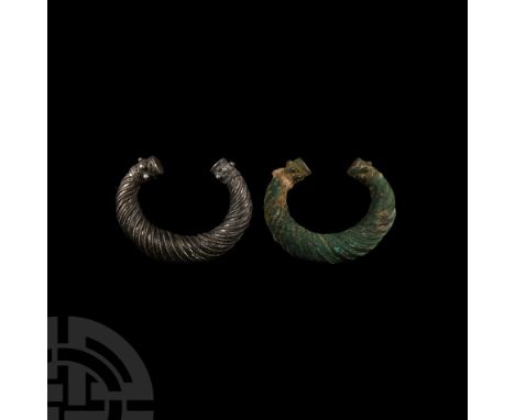 1st millennium B.C. Each composed of a penannular round-section body tapering towards drum-shaped terminals adorned with a ba