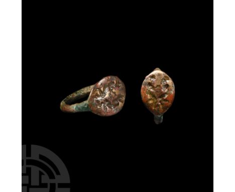 4th-2nd century B.C. Composed of a hoop with convex outer face and an elliptical bezel bearing two incuse human figures, knee