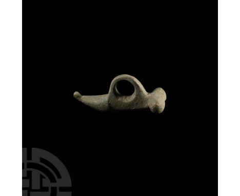 1st-3rd century A.D. Formed with stylised anatomical detailing and an integral suspension loop. 8.23 grams, 33 mm (1 1/4 in.)