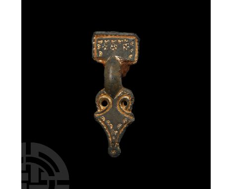 6th-7th century A.D. Of miniature classic form, the headplate having a billeted border and a series of crescentic punchmarks 