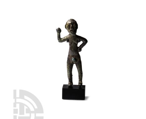 Circa 1st century B.C.-5th century A.D. Formed with right hand raised and left hand on the hip, standing nude, ovate face wit