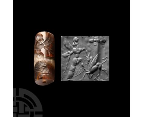 Circa 10th century B.C. Displaying a winged god standing left battling a winged quadruped, a large winged insect in the field