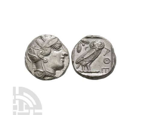 After 449 B.C. Obv: head of Athena to right, wearing crested Attic helmet decorated with three olive leaves and palmette. Rev