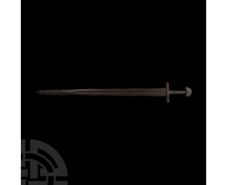 10th-11th century A.D. Comprising a fine double-edged tapering blade, shallow fullers and defined cutting edges showing trace
