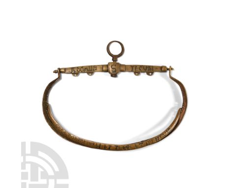 15th-16th century A.D. The bar with central D-shaped block pierced vertically by a stud surmounted by the suspension loop, wi