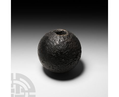 Early 19th century A.D. Featuring a circular opening to receive fuse and plug to one face; hollow-formed. See McConnell, D., 