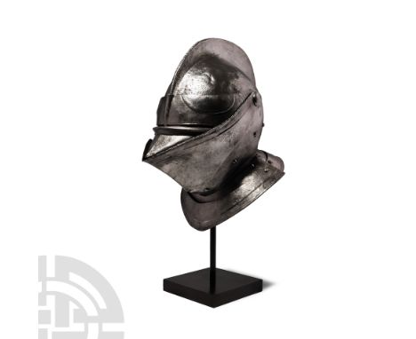 Circa 1560 A.D. An armet with rounded one-piece skull raising to a roped medial comb, visor, prow shaped upper bevor and bevo