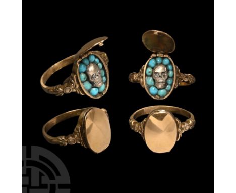 Circa 1800 A.D. Comprising a slender hoop with shell-shaped shoulders, hinged oval bezel with secret compartment revealing a 