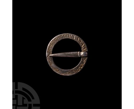 13th-14th century A.D. Retaining an articulate flat-section tongue looped around a narrow inset in the ring; the outer face d