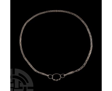 10th-11th century A.D. Composed of openwork links, coiled filigree collars and a central hoop with intertwined bezel and coil
