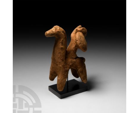 7th-5th century B.C. Modelled in the round, the stylised horse standing on stub legs, with a long neck and detailing to its e