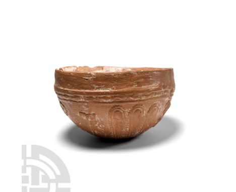 2nd century B.C. Hemispherical in form with decoration in relief featuring fluting alternating with nymphs and symbols beneat