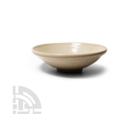 Song Dynasty, 969-1279 A.D. or later. Of shallow conical form with a decorative glaze and ring foot. 121 grams, 11.7 cm wide 