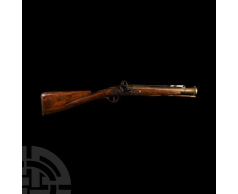 18th century A.D. Featuring steel flintlock action and spring-hinged triangular section bayonet with sliding retaining catch;