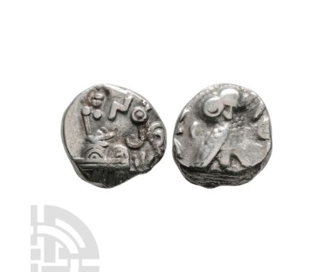 354-300 B.C. Obv: head of Athena right, eye in profile, wearing crested helmet with two olive leaves and scroll, and circular