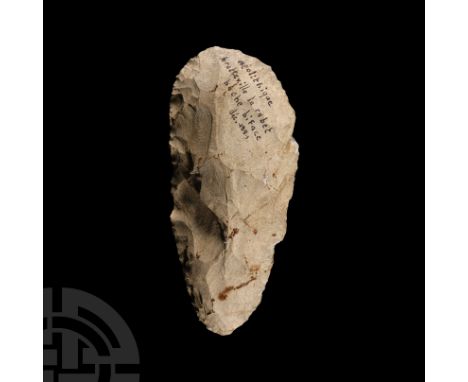 Neolithic Period, 6th-4th millennium B.C. With convex cutting edge tapering to a rounded butt; with inked 'neolithique / bret