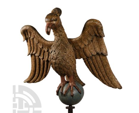 Flanders, 16th century A.D. Painted and carved in the round as an imposing eagle standing atop a globe, wings half-spread, se