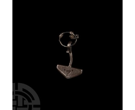 10th-12th century A.D. With stamped triangle and pellets to each face, curled suspension loop and silver-wire ring. Cf. West,