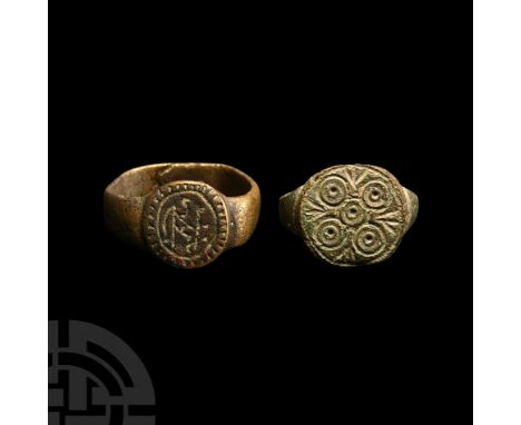 15th-16th century A.D. Comprising one example with ring-and-dot motifs in a cruciform arrangement; one with possible monogram