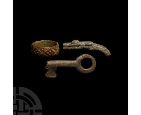 Circa 18th century A.D. The gun formed in the round with simple detailing; ring engraved with band of stylised flowerheads an