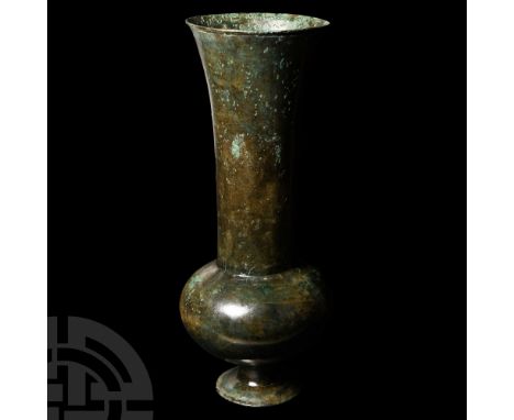 Circa 3rd century B.C. Featuring a squat piriform body, flared cylindrical neck and short waisted stem with everted foot. 227