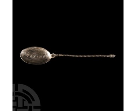 Circa 4th century A.D. Composed of a decoratively twisted slender stem with onion knop finial and roughly D-shaped neck forme