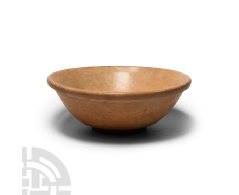 Tang Dynasty, 618-907 A.D. or later. Formed with a gently tapering convex side wall, everted rim and ring foot. 512 grams, 17