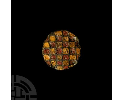 1st century B.C.-1st century A.D. The upper face slightly domed, attachment peg to the reverse; the face with grid of chample