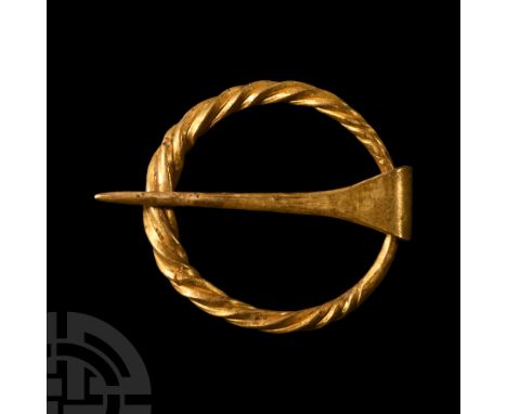 Circa 10th century A.D. Composed of a decoratively twisted tapering annular ring and a free-running tongue of tapering round-
