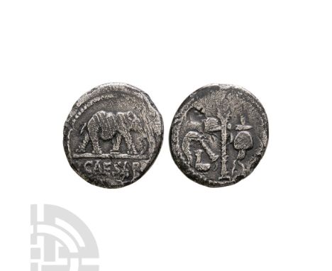 49 B.C. Obv: elephant right trampling dragon (or serpent); CAESAR in exergue. Rev: simpulum, sprinkler, axe and apex emblems.