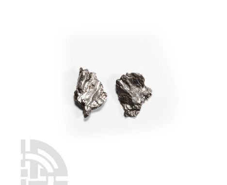 Fell 6000-5000 years B.P. Two nickel iron (IAB) meteorites with irregular surfaces and a composition of 92.9% iron, 6.7% nick