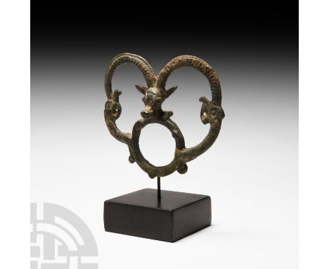 13th-6th century B.C. Comprising a ring surmounted by a facing ibex head with the horns extending to two beast-heads emerging